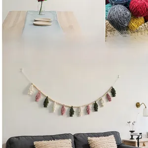 Detail of Nordic wooden bead garland with colorful handmade tassels for wall decoration