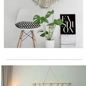 Detailed macro view of bohemian hand-woven macrame wall hanging with cotton tassels