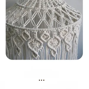 Detailed close-up of handmade macrame cotton rope lampshade with fringe and geometric weave