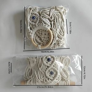 Bohemian handmade cotton macrame wall hanging with blue evil eye beads and wood accents