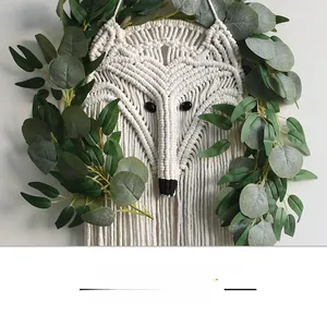 Detailed macro view of handmade macrame fox wall hanging with intricate rope knotting