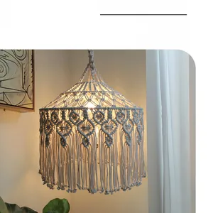 Detail of handcrafted macramé lampshade with cotton rope textures and fringe tassels