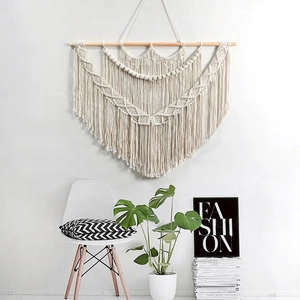 Bohemian handmade macrame wall hanging with geometric weave and tassels for home decor