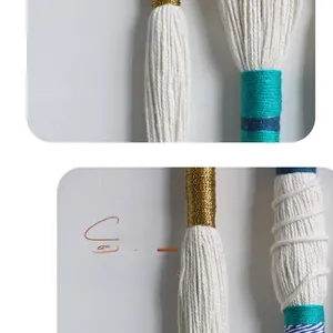 Close-up of handmade macrame tapestry with colorful thread detail and cotton fringes