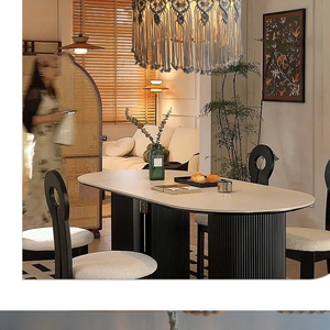 Detail of bohemian hand-woven cotton macrame lampshade in a modern dining room setting