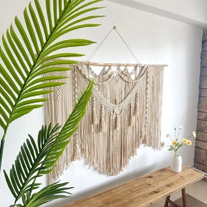 Handmade Bohemian wall hanging tapestry with cotton tassels and geometric woven patterns
