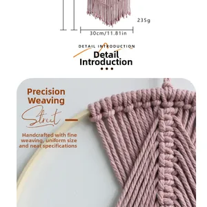 Detailed macro view of pink macrame wall hanging with intricate handmade weave patterns