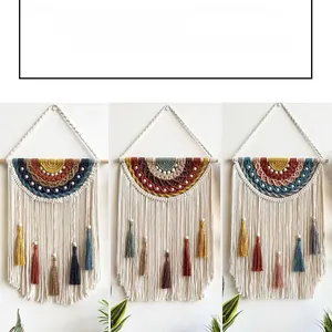 Detail of three handmade bohemian rainbow macrame wall hangings with wood beads and tassels