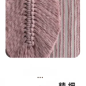 Detailed macro view of pink macrame weaving texture and cotton fringe craftsmanship