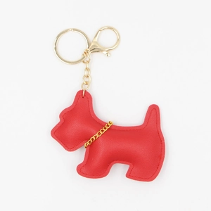 Detail of red faux leather dog keychain with gold chain collar and metal lobster clasp
