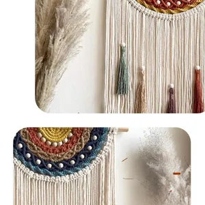 Macro detail of Bohemian macrame wall hanging with colorful cotton fringe and wooden support
