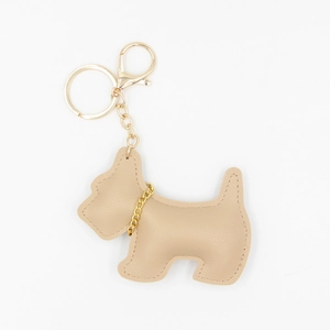 Cute beige leather dog keychain with gold metal chain and lobster clasp on white background