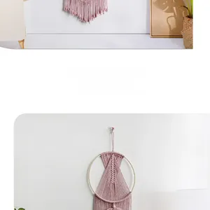 Detail of pink handmade macrame wall hanging with bohemian woven texture and wooden ring