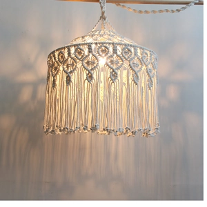 Detailed close-up of Bohemian handmade woven cotton rope lampshade with fringe decor