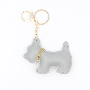 Detail of grey PU leather Scottish Terrier keychain with golden chain and clasp