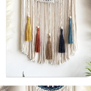 Detail of macrame wall hanging with colorful tassels and natural wooden beads decoration