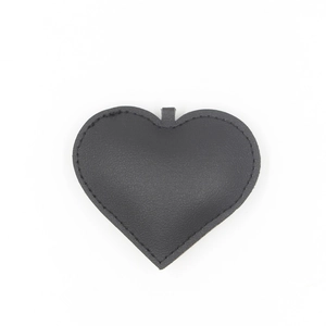 Classic black leather heart keychain with litchi texture and premium stitching