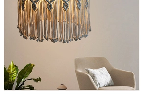 Detail of hand-woven cotton macrame lampshade with elegant fringe for boho home decor