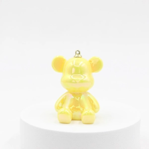 Cartoon laser bear keychain with yellow pearlescent resin finish and golden ring