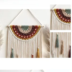 Detail of bohemian handmade woven wall hanging with colorful rainbow fringes and beads