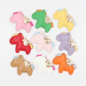 Colorful leather horse keychains with gold money bag pendants in nine distinct colors