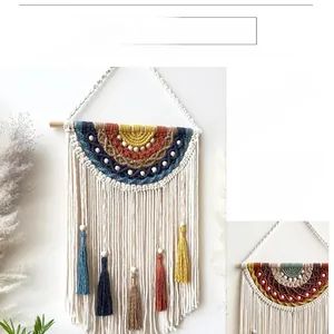 Detailed macro view of Bohemian hand-woven wall hanging with colorful cotton tassels