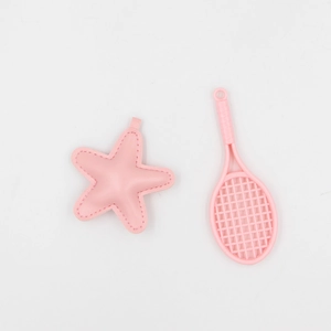Pink star and tennis racket keychain set on white background for bag charm accessories