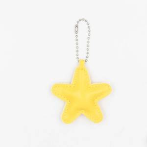 Detail showing yellow PU star pendant with silver bead chain and fine stitching detail
