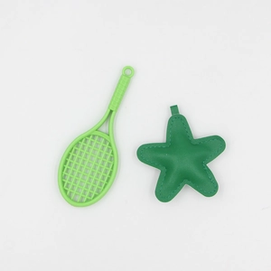 Mini green tennis racket and star-shaped leather keychain for bags and accessories