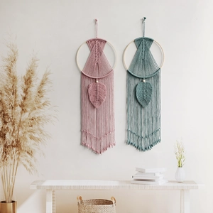 Handmade bohemian woven wall hanging set with pink and teal leaf tassels for home decor