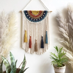 Handmade Macrame wall hanging with colorful rainbow pattern and decorative cotton tassels