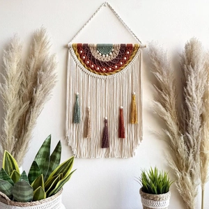 Bohemian macrame wall hanging with colorful yarn loops and tassels for home decor