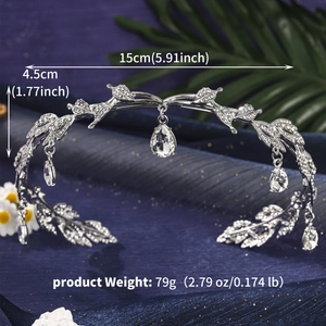 Detailed view of silver crystal tiara with leaf design and teardrop pendants