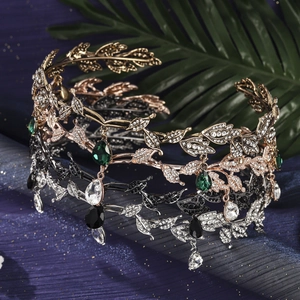 Detailed close-up of leaf-shaped bridal tiaras with sparkling rhinestones and drop pendants