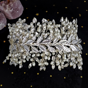 Close-up of handmade silver leaf headband with woven pearls and sparkling crystals