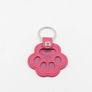 Detailed pink leather cat paw keychain with heart window and silver metal ring
