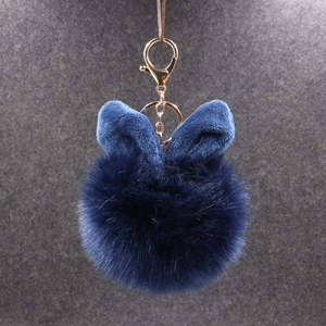 Porte-clés pompon en peluche bleu foncé avec oreilles de lapin et fermoir doré chic