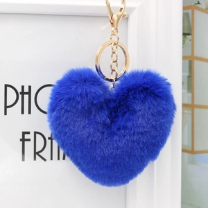 Close-up of royal blue fluffy heart plush keychain with elegant golden metal lobster clasp