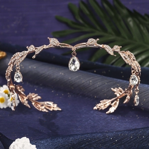 Detail of rose gold crown headband with sparkling crystals and teardrop pendants