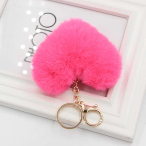 Fuchsia heart plush pompom keychain with gold alloy ring and lobster clasp on frame