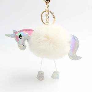 Unicorn plush faux fur pompom keychain with iridescent leather details and gold clasp