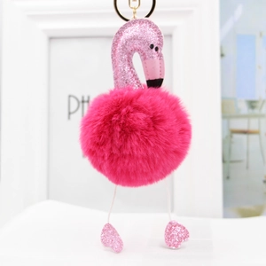 Close-up of pink glitter flamingo head and fluffy magenta pom-pom keychain details