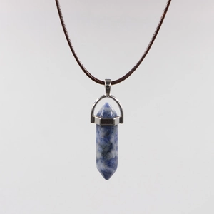 Detail of blue sodalite hexagonal prism pendant with silver clasp and wax cord