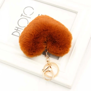 Close-up of caramel plush heart keychain with premium gold lobster clasp and key ring