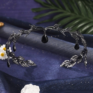 Close-up of black gothic leaf crown headband featuring dark teardrop crystal pendants