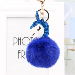 Dunkelblauer flauschiger Einhorn-Bommel-Schlüsselanhänger mit Paillettenhorn und Goldclip