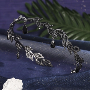 Detailed view of dark gothic crown featuring black leaves and teardrop crystals