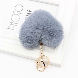 Close-up of grey heart-shaped plush keychain with premium golden metal lobster clasp and ring
