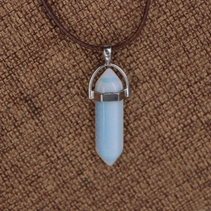 Hexagonal opalite crystal pendant necklace with brown braided cord on burlap base