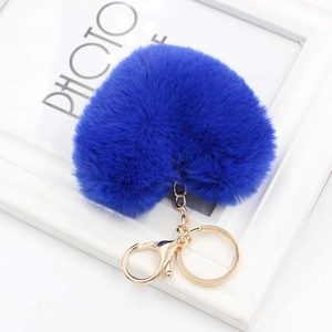 Royal blue plush heart-shaped keychain with gold metal clasp on white background